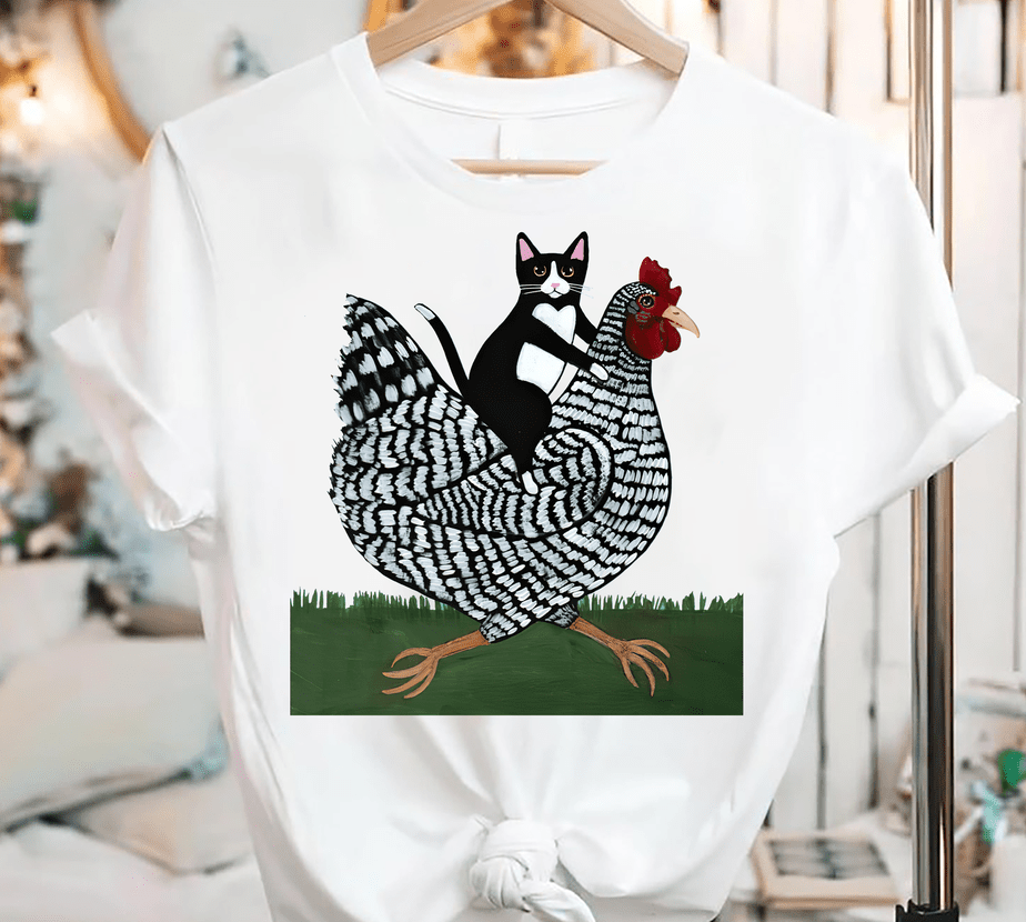 cat riding a chicken shirt